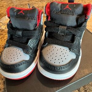 Kids Black and Red Nike Sneakers